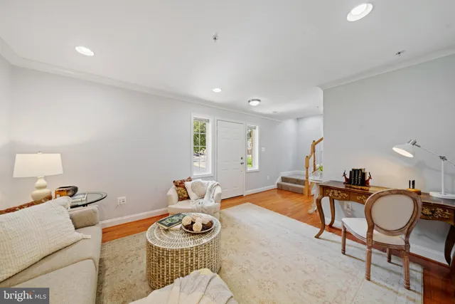 a living room with furniture and gym equipment