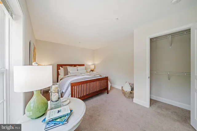 a bedroom with a bed and lamp