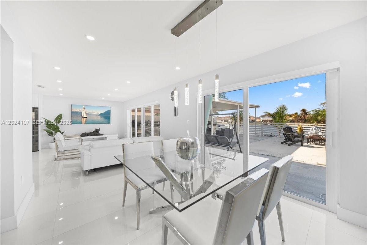 15341 Southwest 36th Street Miami, FL 33185 - Photo 14 of 56 a dining room with furniture and a view of kitchen