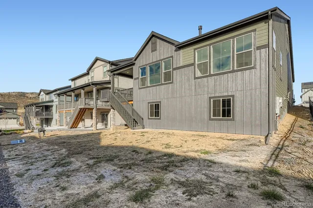 a view of balcony with two chairs