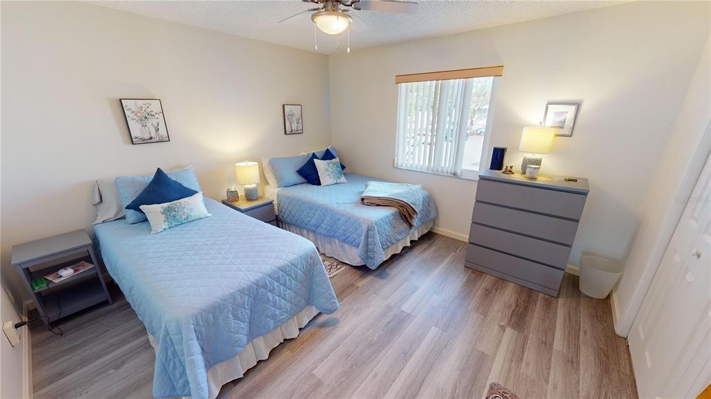 22375 Edgewater Drive, Unit 147 Punta Gorda, FL 33980 - Photo 18 of 31 a bedroom with two beds and windows