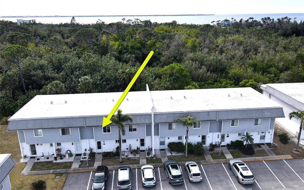 22375 Edgewater Drive, Unit 147 Punta Gorda, FL 33980 - Photo 2 of 31 a view of house with outdoor space patio and mountain view