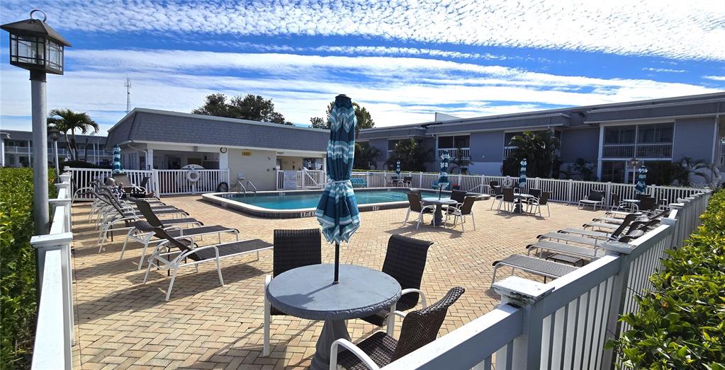 22375 Edgewater Drive, Unit 147 Punta Gorda, FL 33980 - Photo 25 of 31 a view of a patio with couches table and chairs
