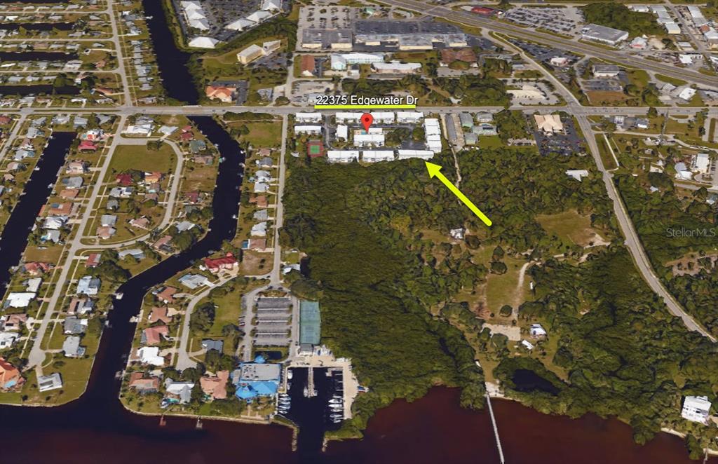 22375 Edgewater Drive, Unit 147 Punta Gorda, FL 33980 - Photo 30 of 31 an aerial view of residential houses with outdoor space