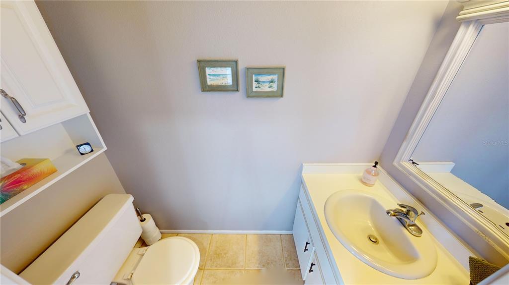 22375 Edgewater Drive, Unit 147 Punta Gorda, FL 33980 - Photo 7 of 31 a bathroom with a sink and toilet