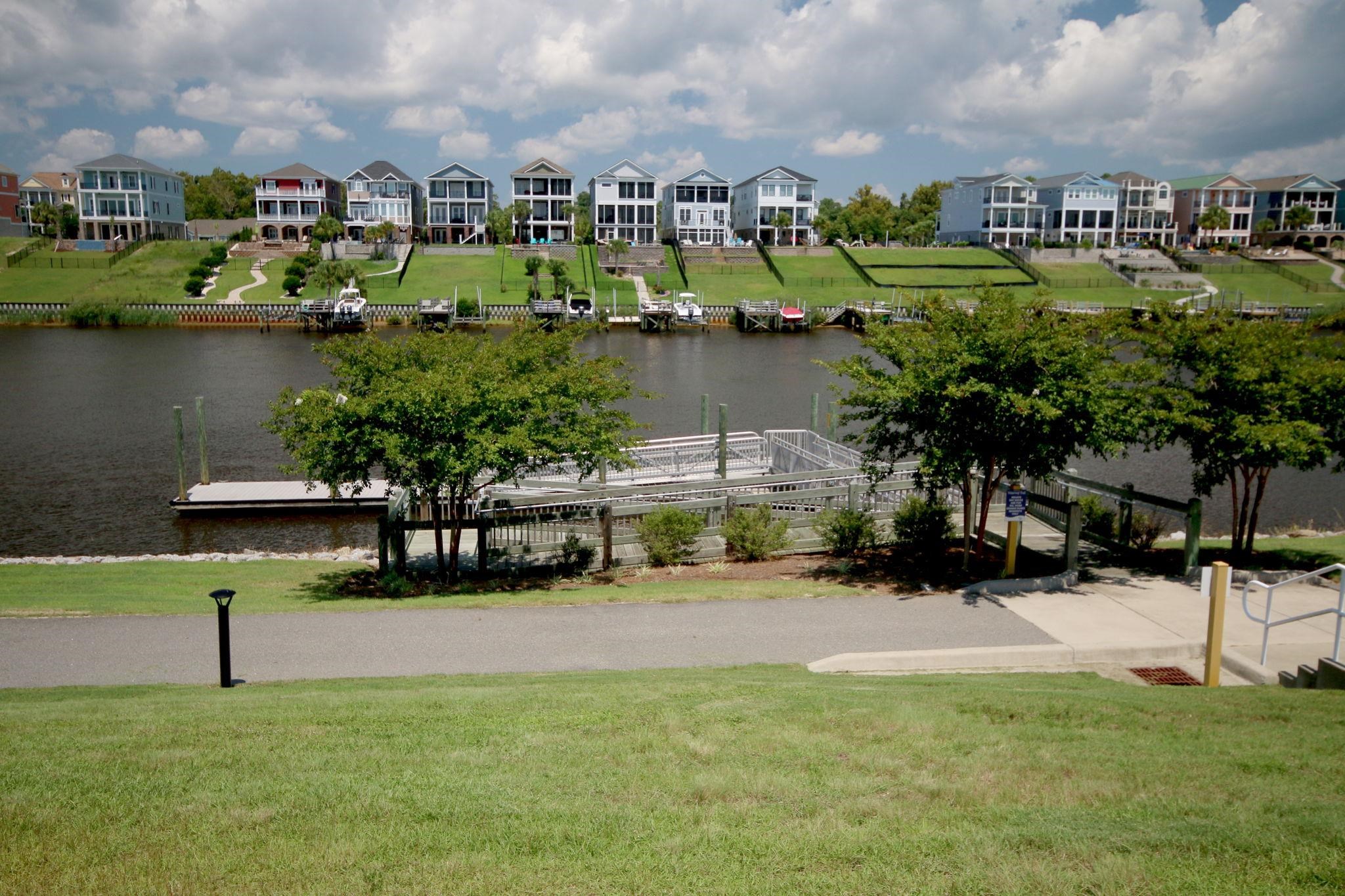 5830 Cremona Drive Myrtle Beach, SC 29577 - Photo 34 of 39 Water view featuring nearby suburban area and a boat dock