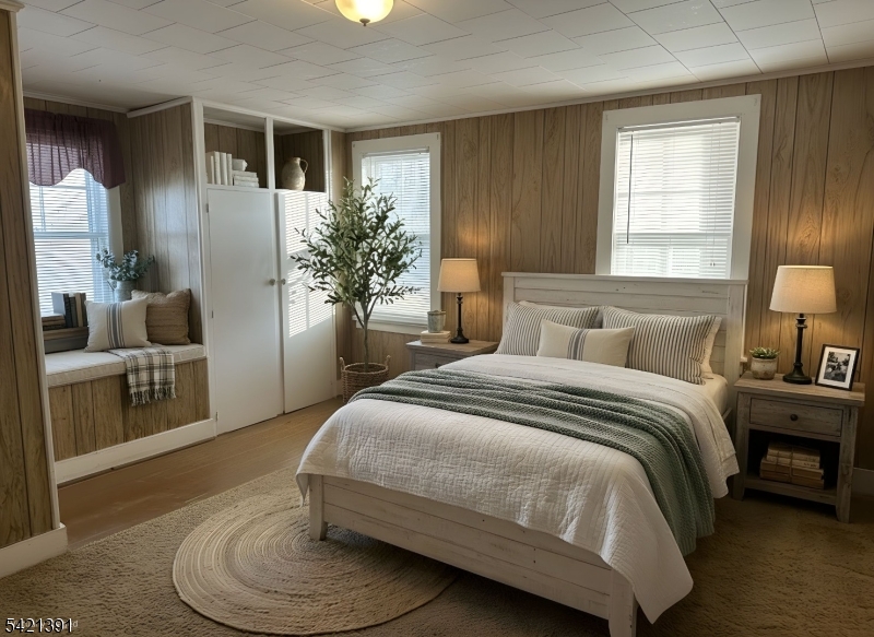 13 Ice Plant Road Lafayette, NJ 07848 - Photo 11 of 19 a bedroom with a large bed and a couch