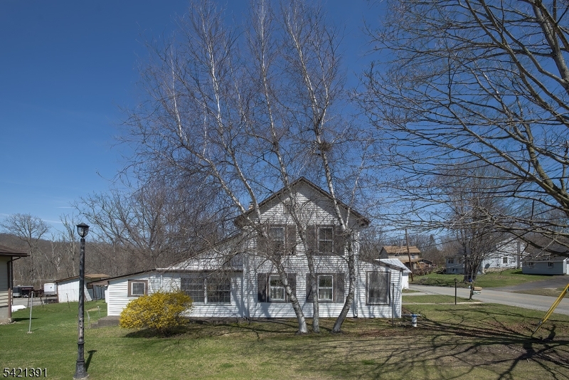 13 Ice Plant Road Lafayette, NJ 07848 - Photo 16 of 19 a view of a large building next to a yard