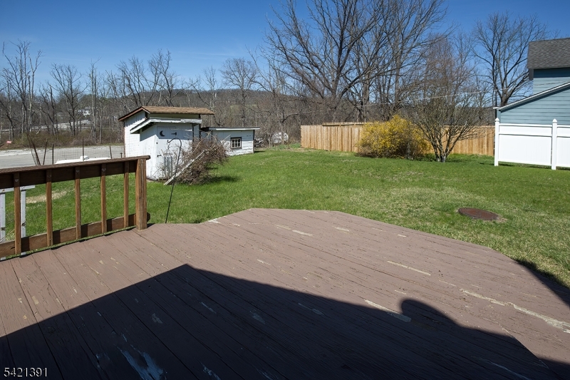13 Ice Plant Road Lafayette, NJ 07848 - Photo 18 of 19 a view of a backyard with wooden fence