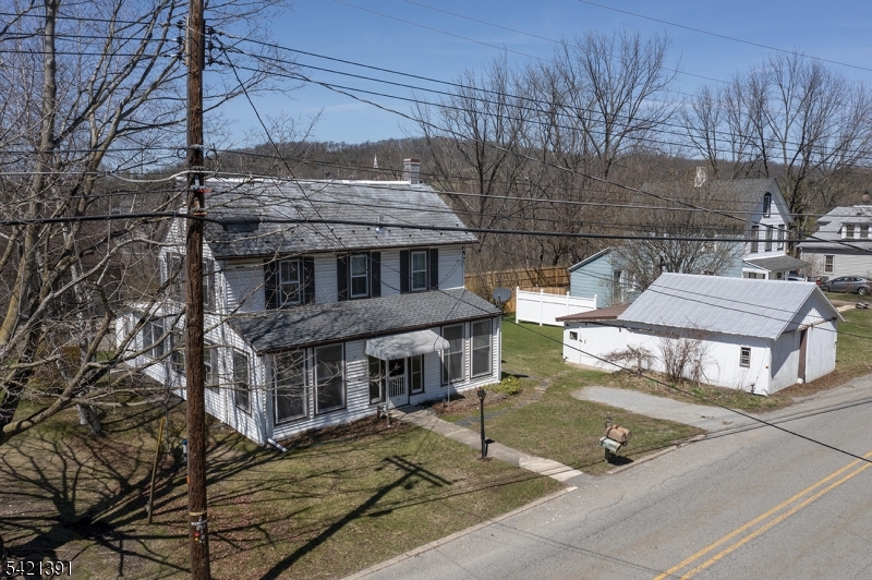 13 Ice Plant Road Lafayette, NJ 07848 - Photo 2 of 19 a aerial view of a house next to a yard