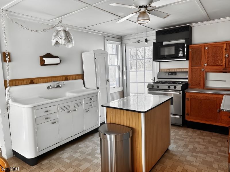 13 Ice Plant Road Lafayette, NJ 07848 - Photo 3 of 19 a kitchen with stainless steel appliances granite countertop a stove and a refrigerator