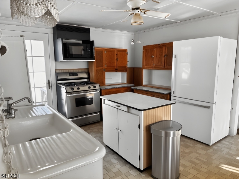 13 Ice Plant Road Lafayette, NJ 07848 - Photo 5 of 19 a kitchen with a refrigerator stove and microwave