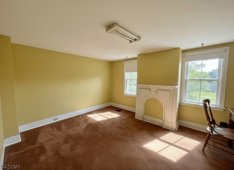 13 Ice Plant Road Lafayette, NJ 07848 - Photo 6 of 19 a view of a workspace with furniture and a window