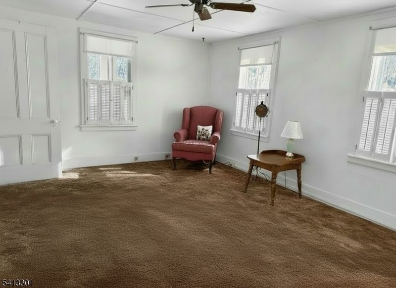 13 Ice Plant Road Lafayette, NJ 07848 - Photo 8 of 19 a living room with furniture and a window