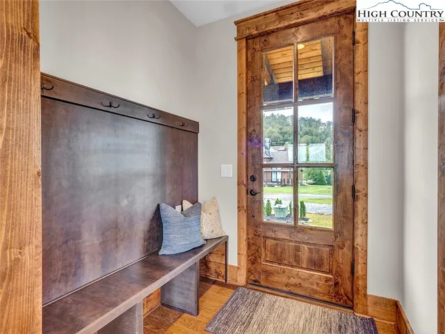 a bathroom with a double vanity sink a mirror and a bathtub
