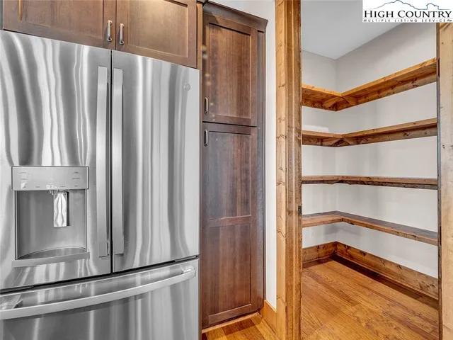 a bedroom with a large bed and a large window