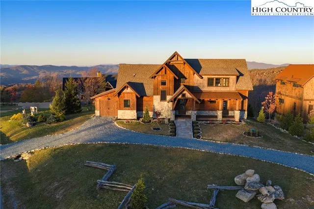 a view of kitchen with stainless steel appliances granite countertop sink stove and refrigerator