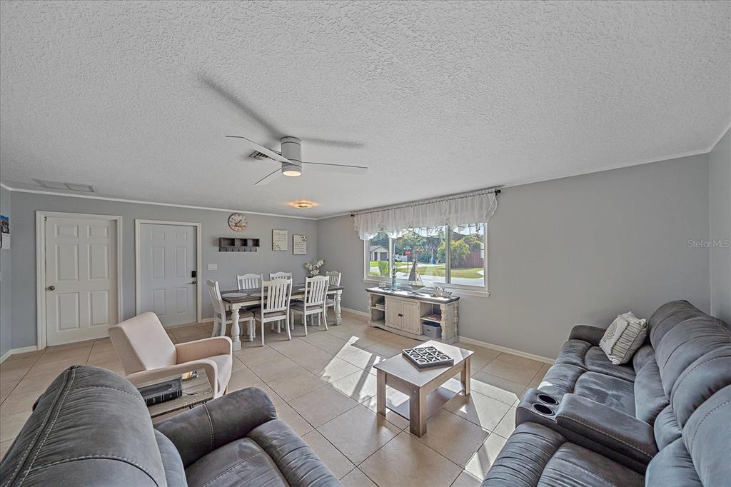772 Locklear Avenue Sarasota, FL 34237 - Photo 13 of 40 a living room with furniture and a large window
