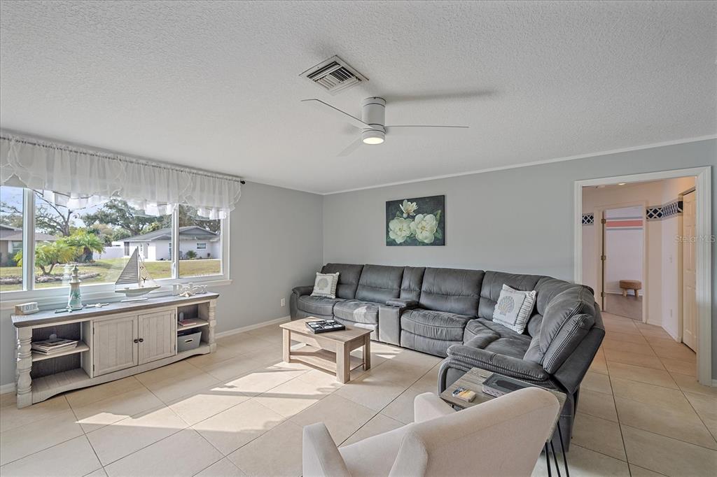 772 Locklear Avenue Sarasota, FL 34237 - Photo 14 of 40 a living room with furniture and a large window