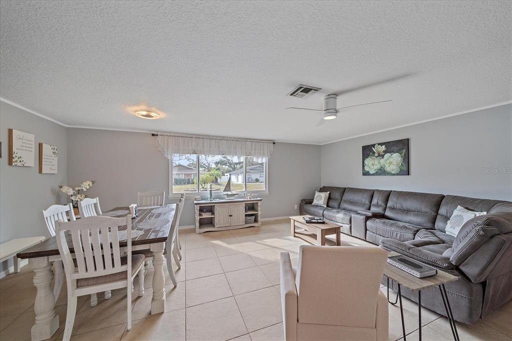 772 Locklear Avenue Sarasota, FL 34237 - Photo 17 of 40 a living room with furniture and a large window