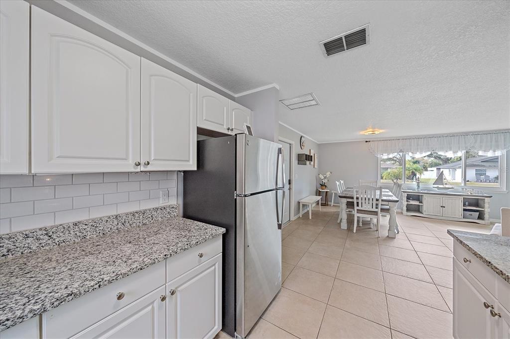 772 Locklear Avenue Sarasota, FL 34237 - Photo 24 of 40 a kitchen with a sink and cabinets