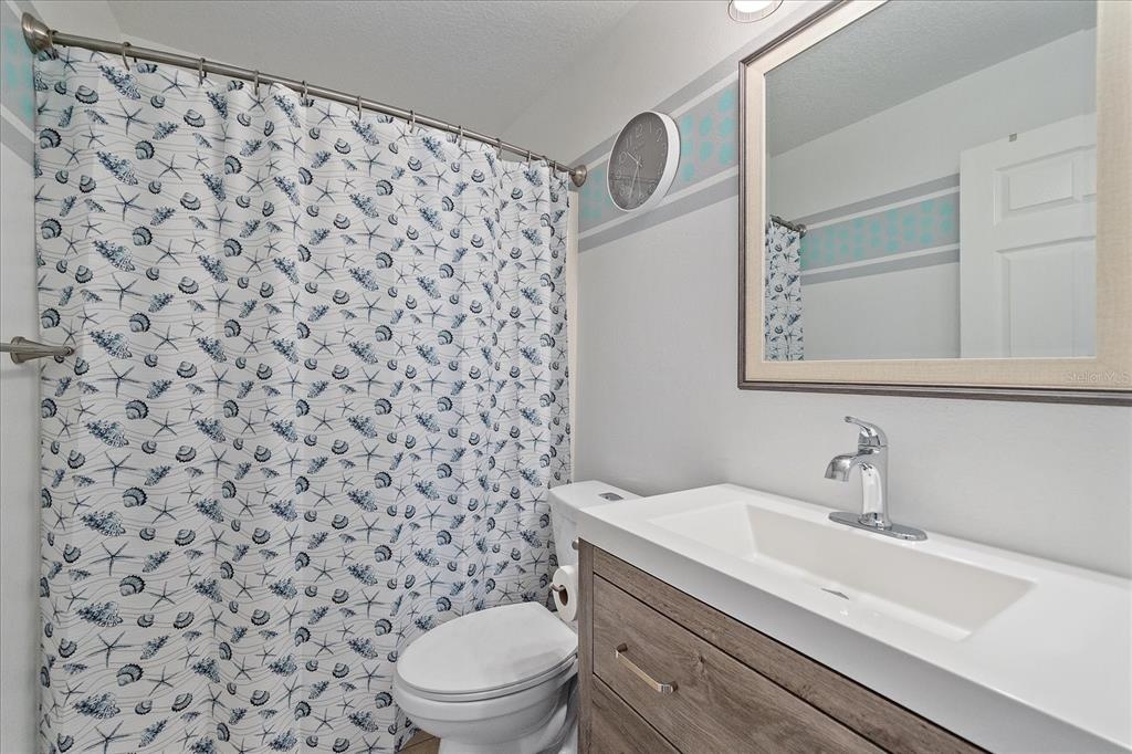 772 Locklear Avenue Sarasota, FL 34237 - Photo 36 of 40 a bathroom with a toilet and a sink