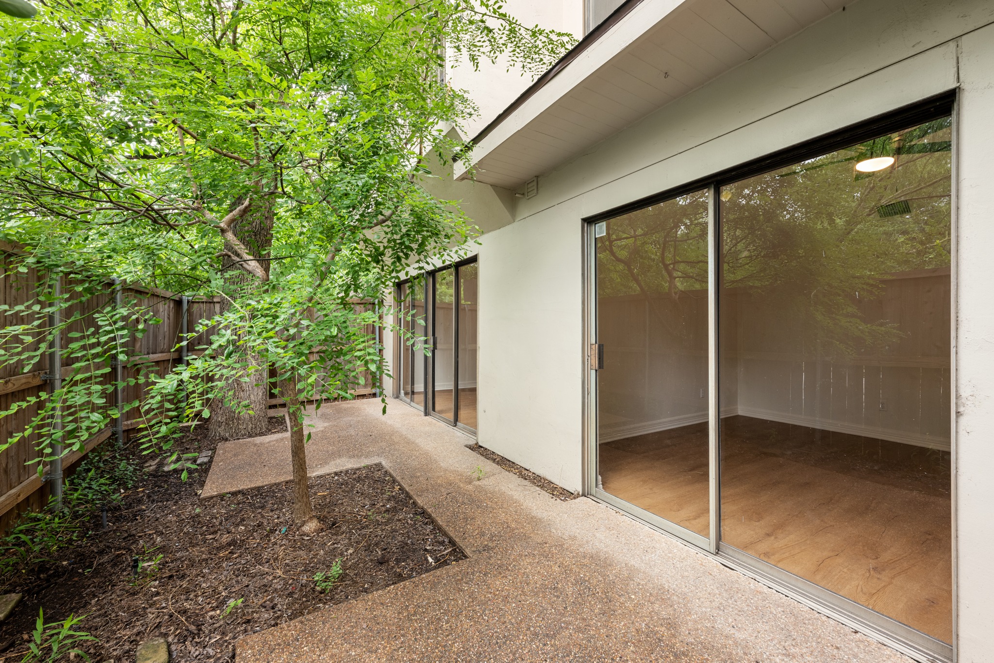 409 East 38th Street, Unit 101 Austin, TX 78705 - Photo 22 of 27 Large patio that runs the length of the condo. This first floor patio is more than double the size of upper patios.
Large established trees offer wonderful shade.