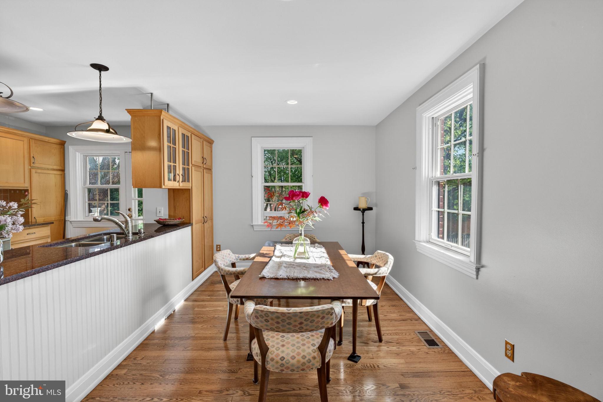 158 Hopkins Road Baltimore, MD 21212 - Photo 12 of 68 a view of a dining room with furniture window and wooden floor