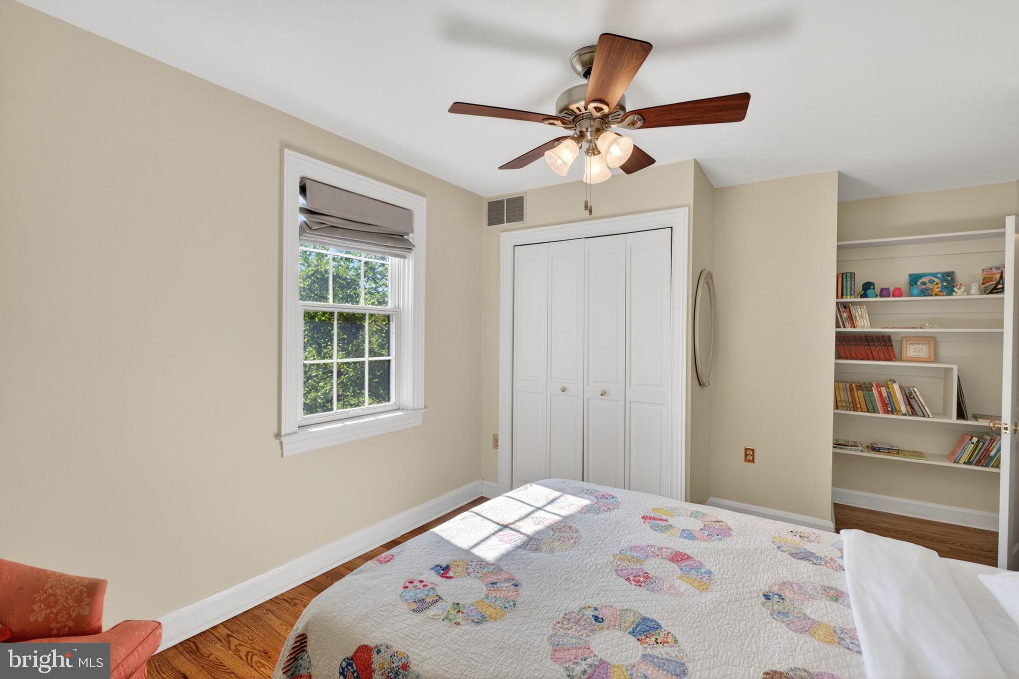 158 Hopkins Road Baltimore, MD 21212 - Photo 28 of 68 a bedroom with a bed and a chandelier