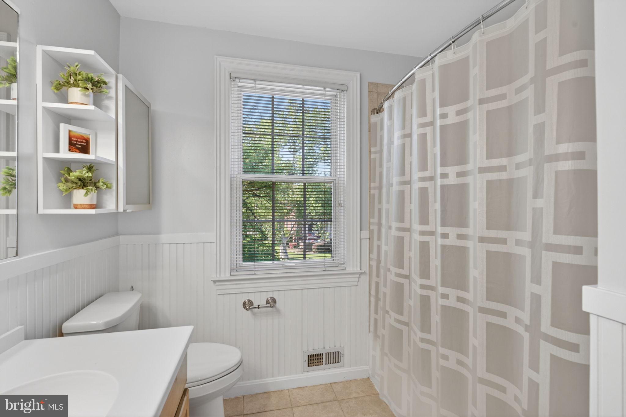 158 Hopkins Road Baltimore, MD 21212 - Photo 34 of 68 a bathroom with a toilet and a shower