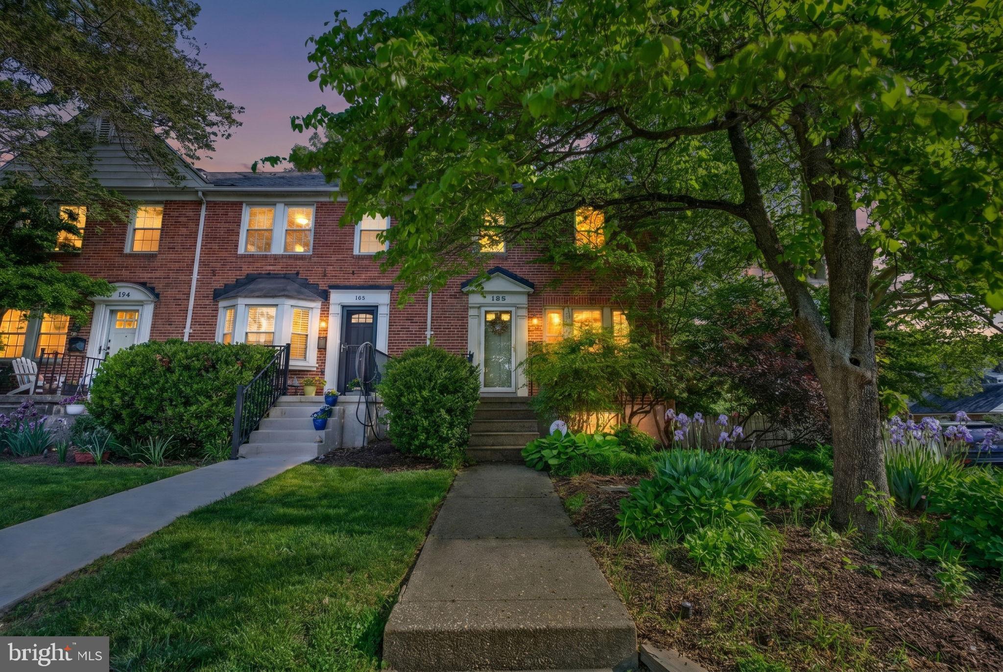 158 Hopkins Road Baltimore, MD 21212 - Photo 5 of 68 a front view of a house with a yard and potted plants