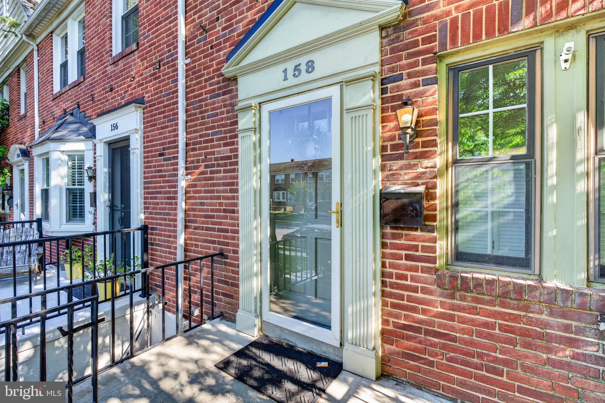 158 Hopkins Road Baltimore, MD 21212 - Photo 6 of 68 a view of a brick house with large windows