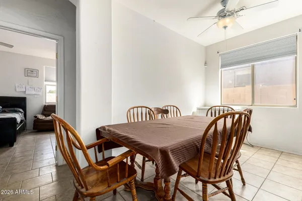 a view of a dining room and livingroom with furniture
