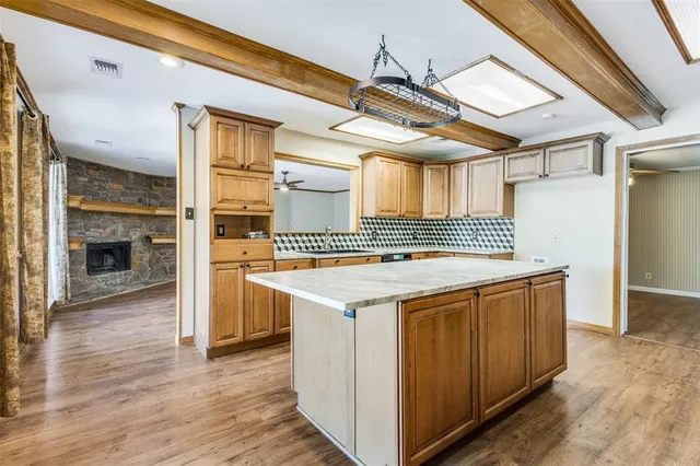 a kitchen with a stove and a refrigerator