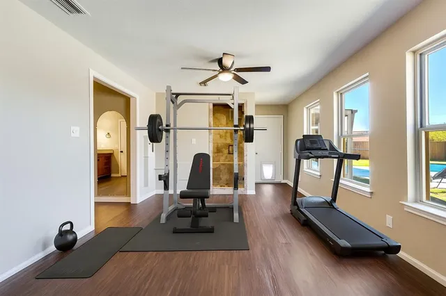 a view of living room with furniture and wooden floor