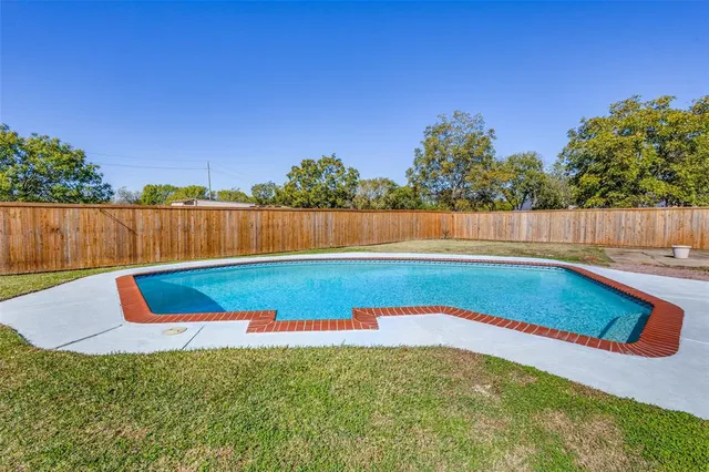 an aerial view of lake and city space