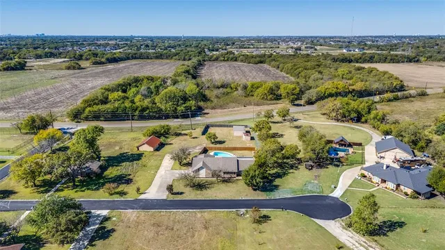 an aerial view of a house with a garden