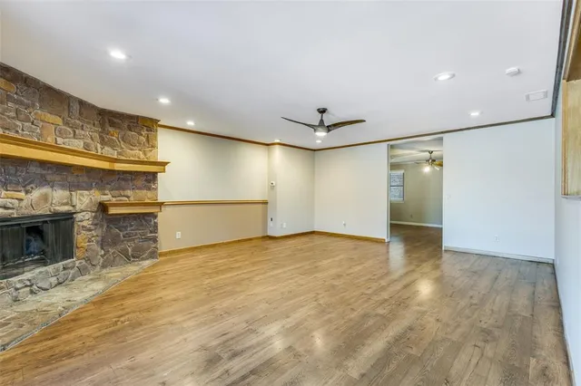 a view of an empty room with a fireplace