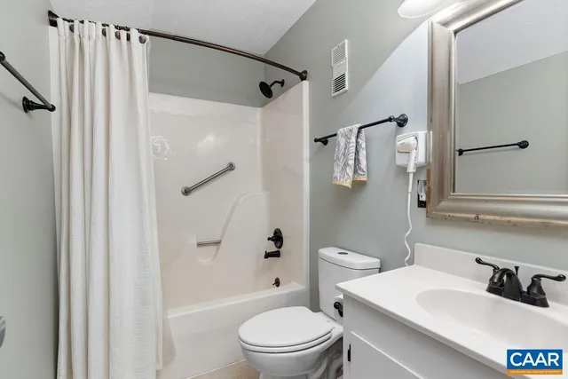 a bedroom with a bed and a mirror