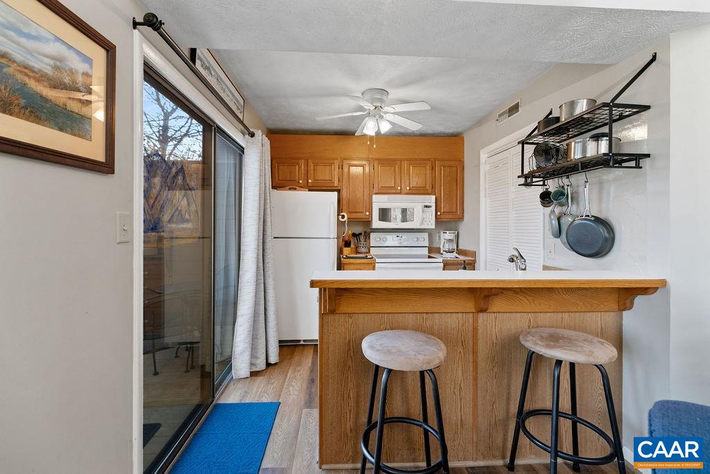 453 3 Ridges Roseland, VA 22967 - Photo 7 of 21 a kitchen with stainless steel appliances a refrigerator and a stove top oven