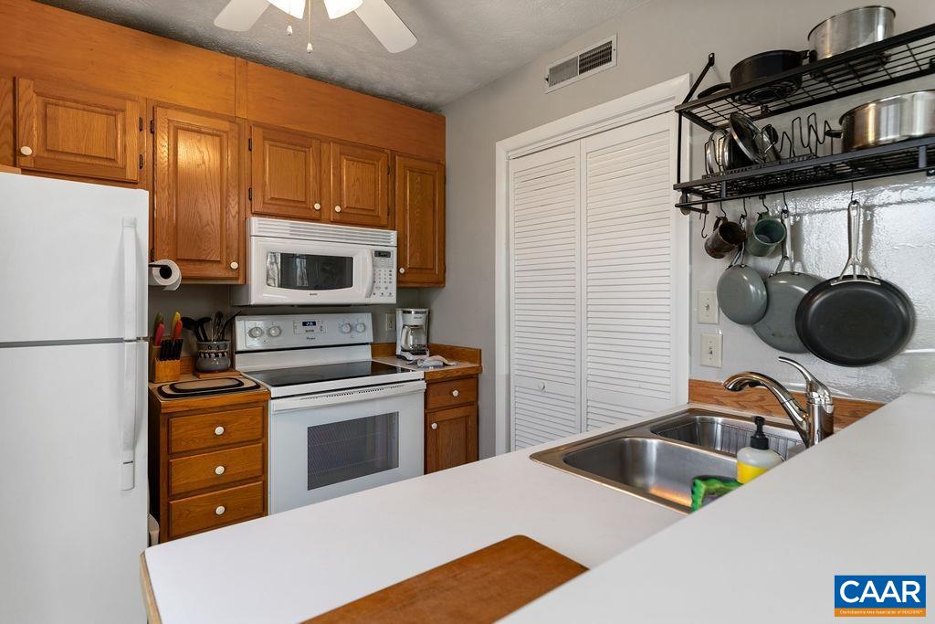 453 3 Ridges Roseland, VA 22967 - Photo 8 of 21 a kitchen with a refrigerator and a sink