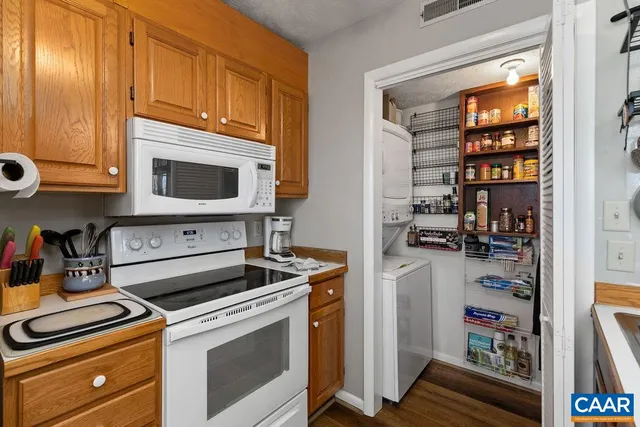 a kitchen with a stove and a microwave