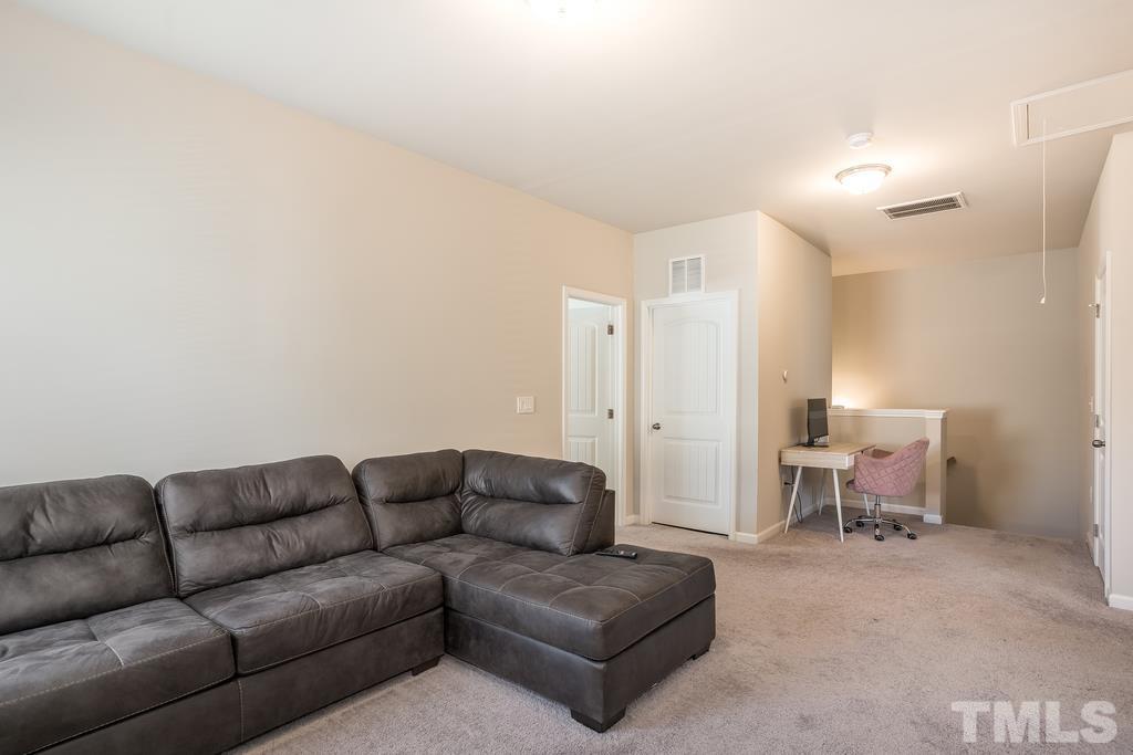 6801 Resting Grove Road Raleigh, NC 27610 - Photo 16 of 28 a living room with furniture and a couch