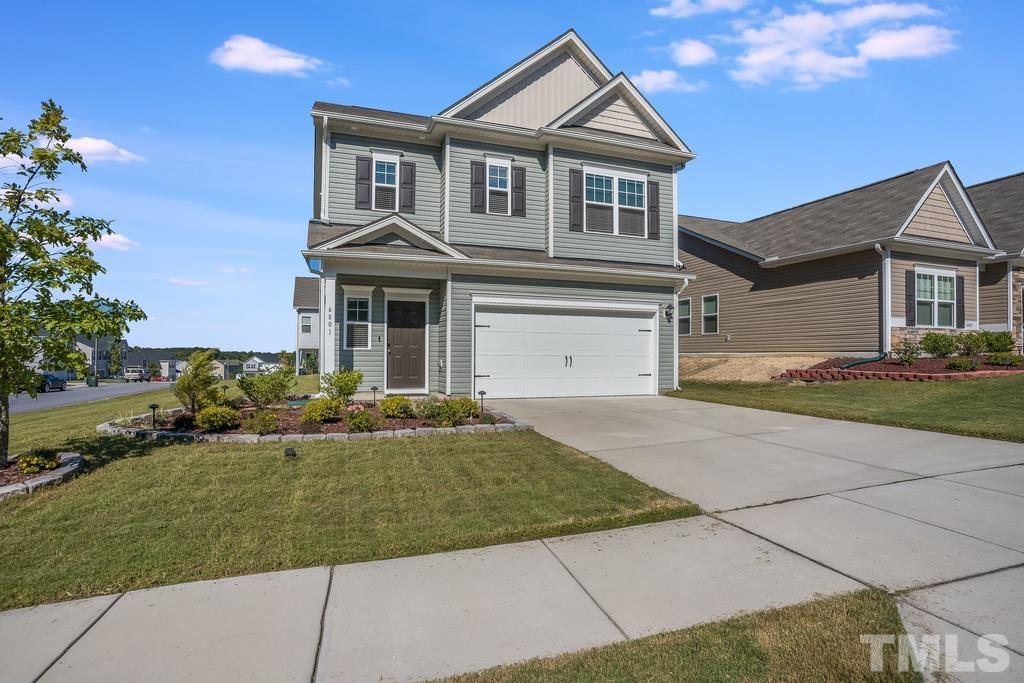 6801 Resting Grove Road Raleigh, NC 27610 - Photo 3 of 28 a front view of a house with a yard