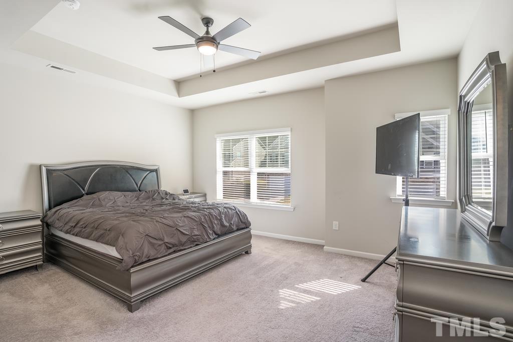 6801 Resting Grove Road Raleigh, NC 27610 - Photo 22 of 28 a spacious bedroom with a bed and window