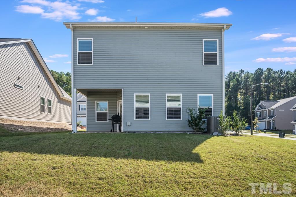 6801 Resting Grove Road Raleigh, NC 27610 - Photo 27 of 28 a front view of a house with a yard