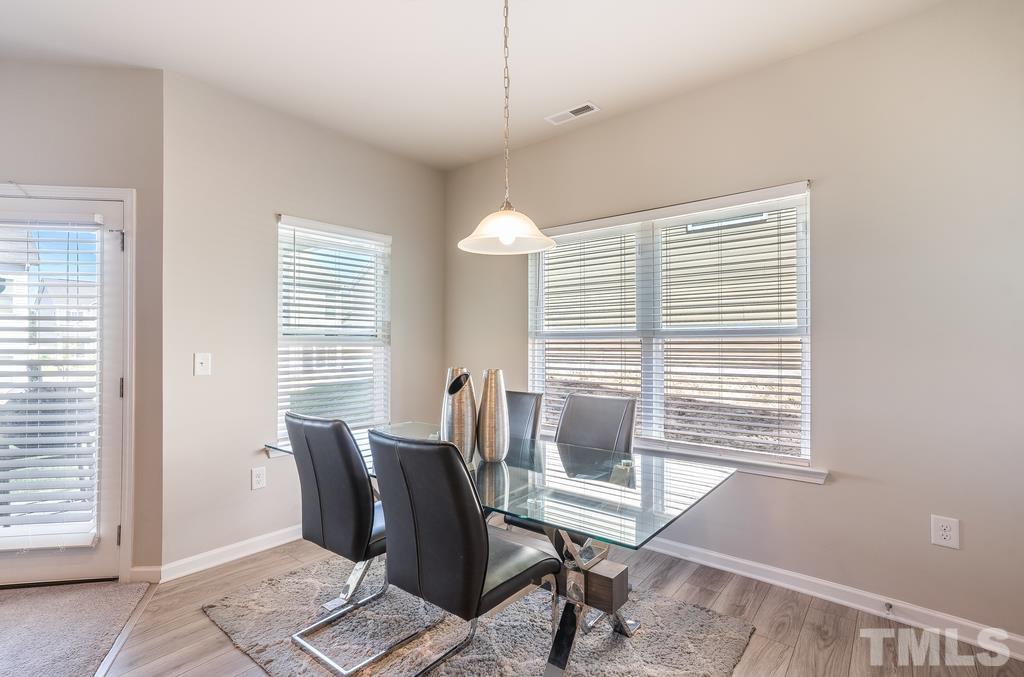 6801 Resting Grove Road Raleigh, NC 27610 - Photo 9 of 28 a view of a workspace with furniture and a window
