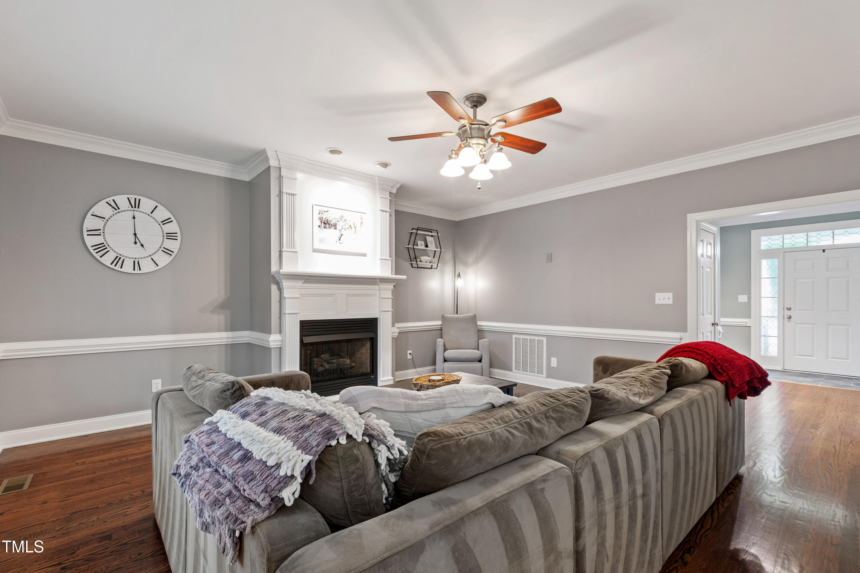 409 Broadmoor Way Clayton, NC 27520 - Photo 10 of 55 a bedroom with a bed and a chandelier