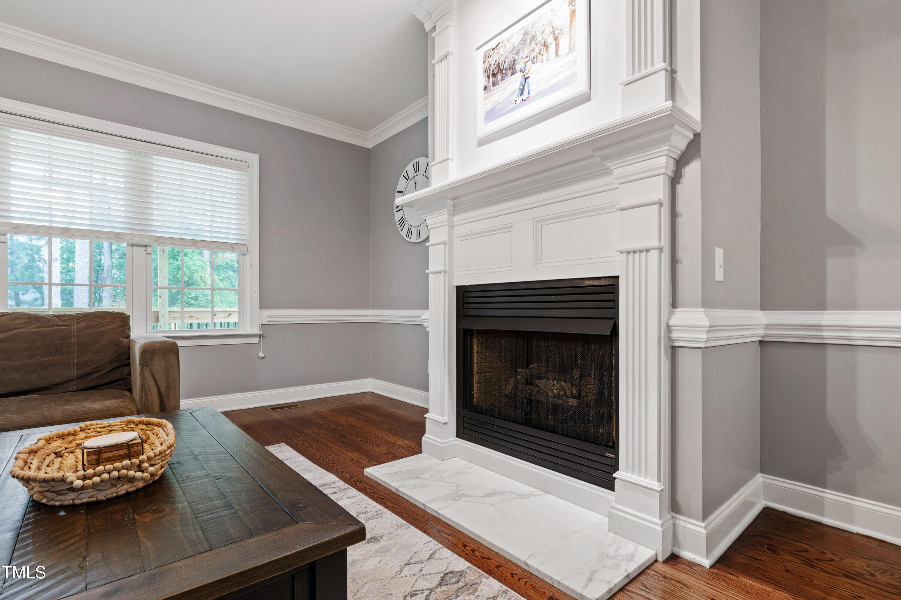 409 Broadmoor Way Clayton, NC 27520 - Photo 12 of 55 a living room with furniture and a fireplace