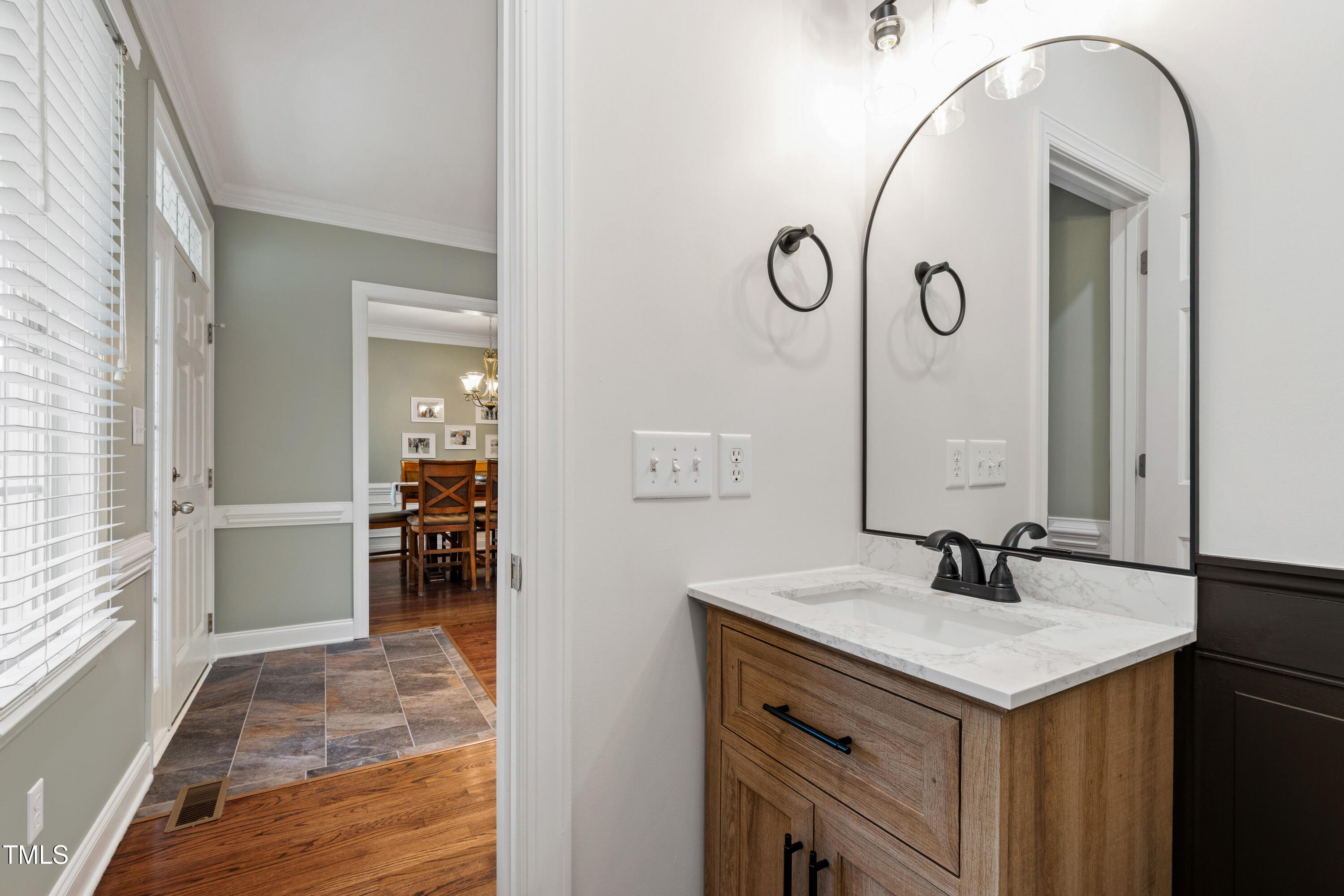 409 Broadmoor Way Clayton, NC 27520 - Photo 13 of 55 a bathroom with a sink and a mirror